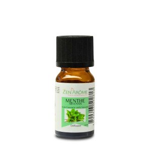  bouteille d’huile essentielle 10 ml entourée de galets et de plantes pour une ambiance spa