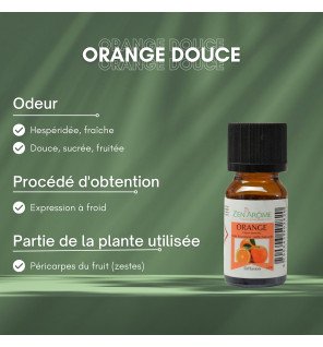  huile essentielle orange douce posée près d’une bougie pour une atmosphère cocooning