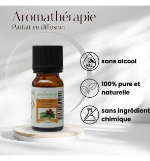  petit flacon d’huile essentielle pin sylvestre avec bouchon noir devant un fond naturel